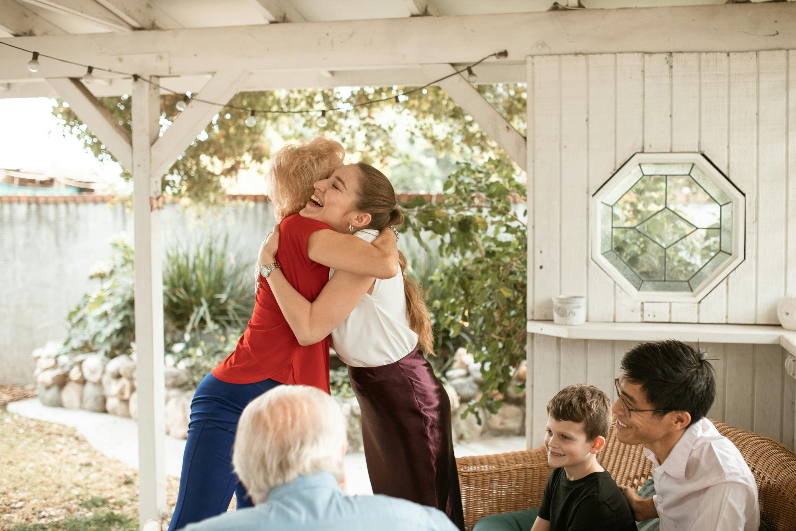 A joyful family gathering outdoors, showcasing happiness and togetherness.